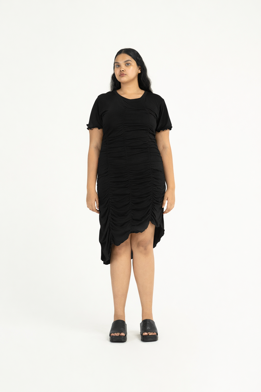 Woman wearing a black dress on a white background