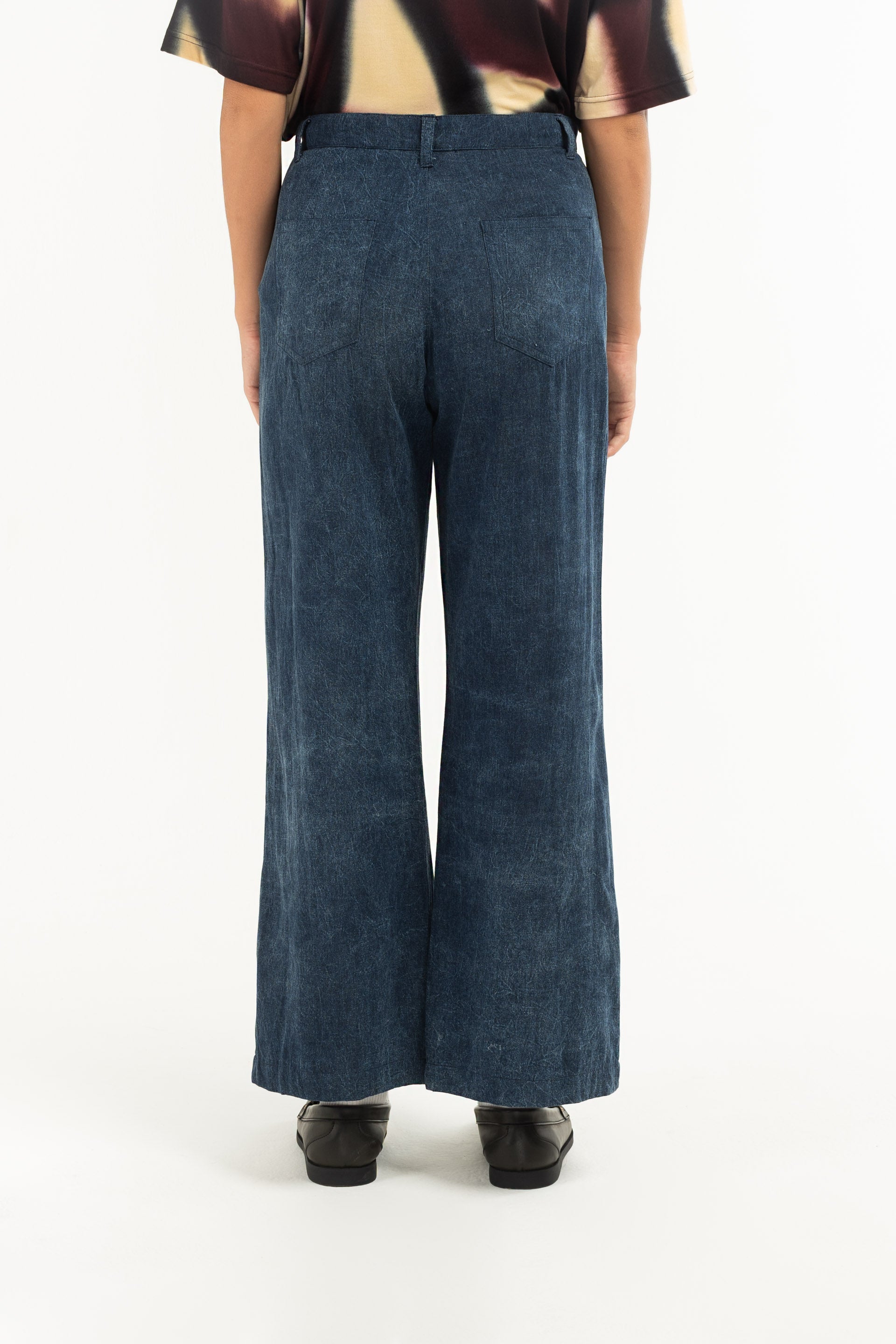 Stonewash Wide Leg Pants are unisex designed and are mid-rise with a wide flare leg that falls just above the ankle. 