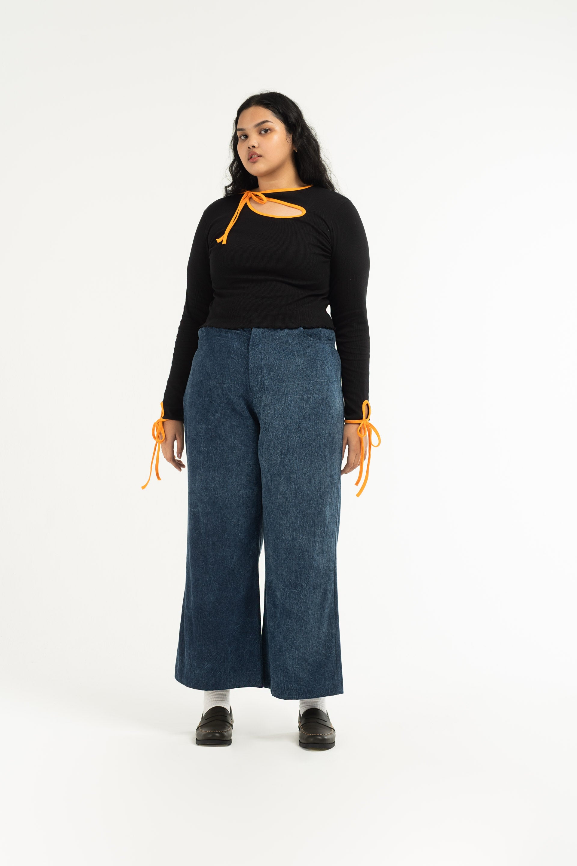 Stonewash Wide Leg Pants are unisex designed and are mid-rise with a wide flare leg that falls just above the ankle. 