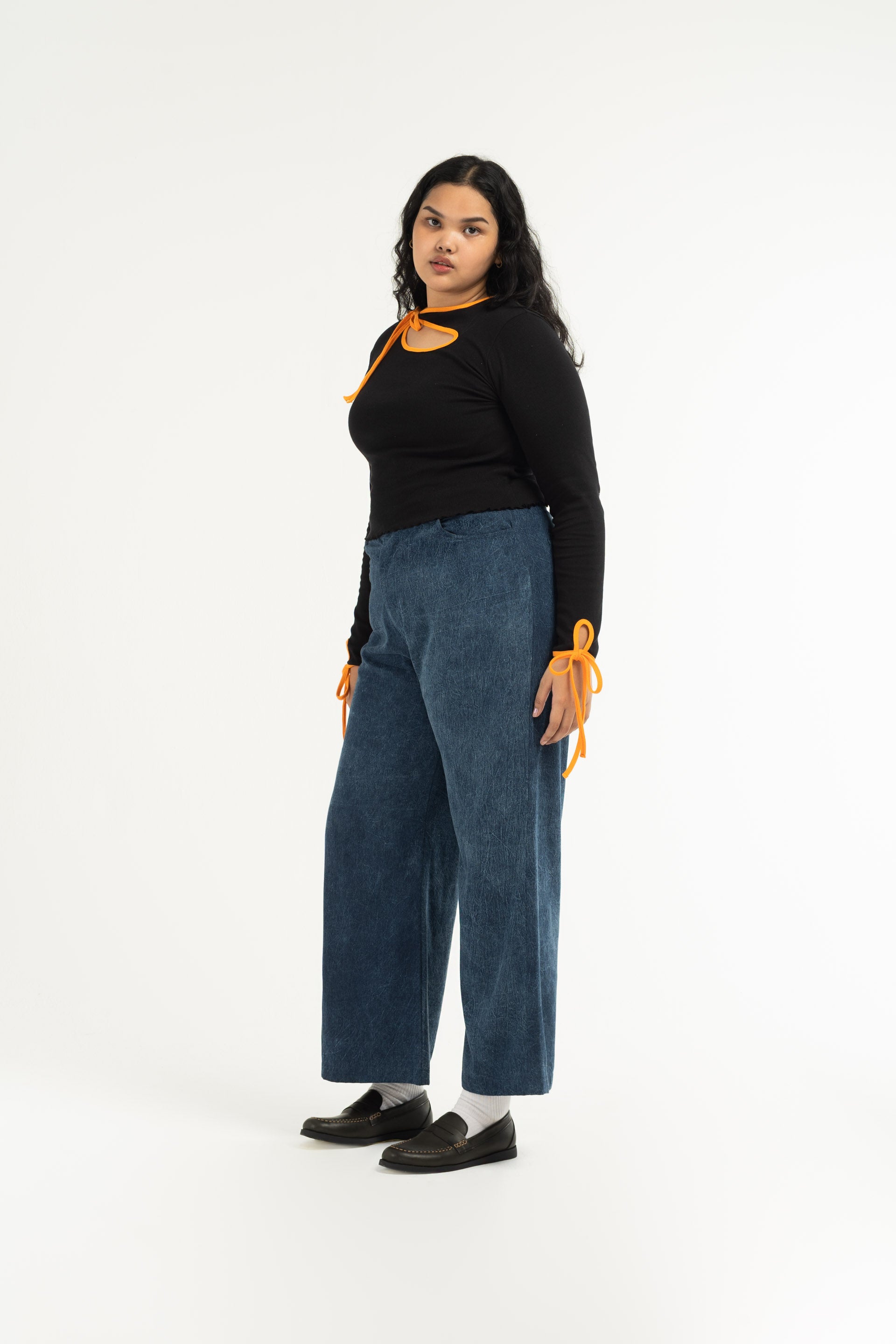 Stonewash Wide Leg Pants are unisex designed and are mid-rise with a wide flare leg that falls just above the ankle. 