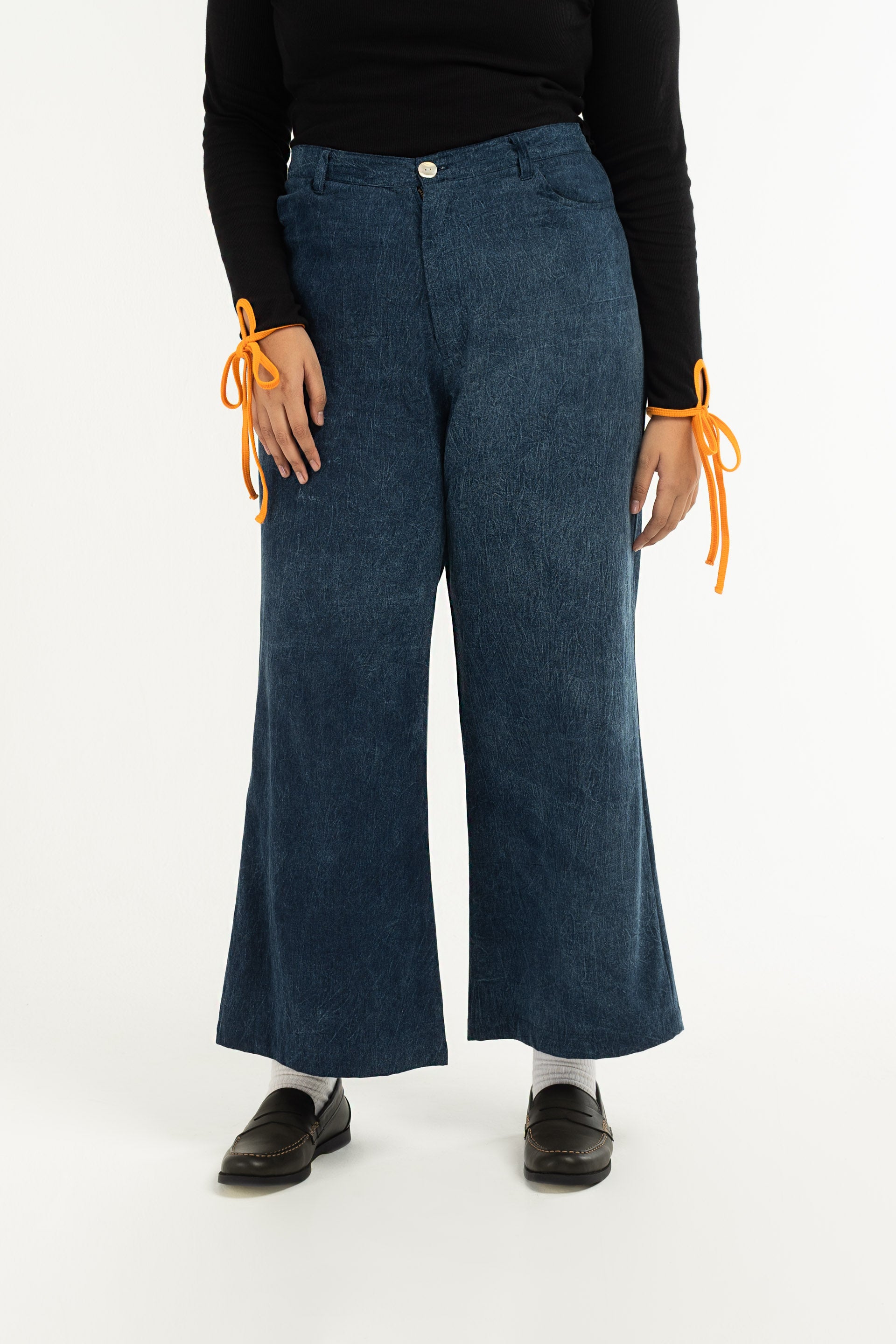 Stonewash Wide Leg Pants are unisex designed and are mid-rise with a wide flare leg that falls just above the ankle. 